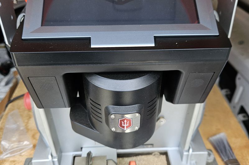 The automatic key cutting machine mounted inside the locksmith van.